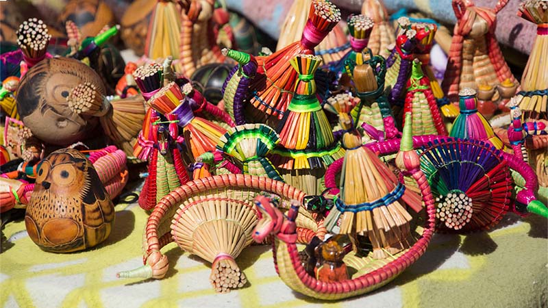 A Close Up View Of A Variety Of Vibrant Handmade Crafts