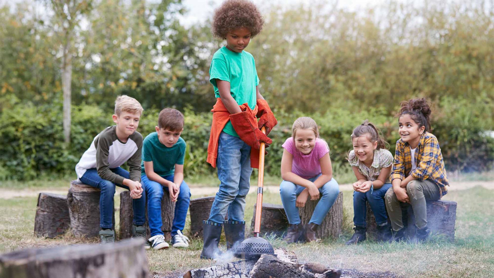 Kids Sitting Around a Campfire