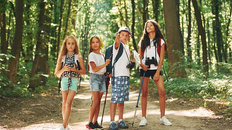 Kids Hiking In The Forest